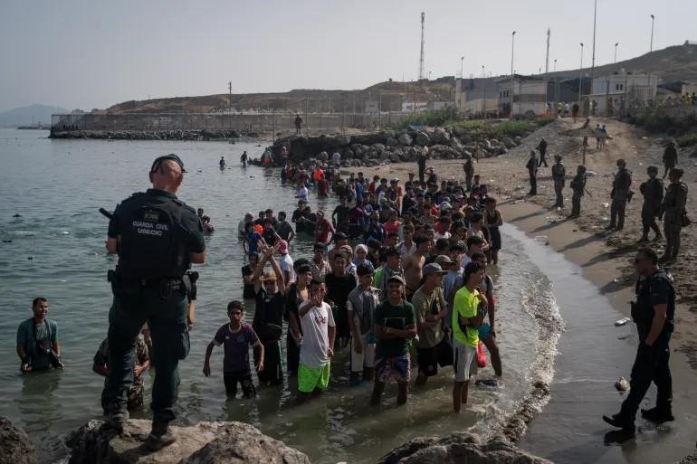 Spain installs floating barrier in Ceuta after deadly influx of migrants